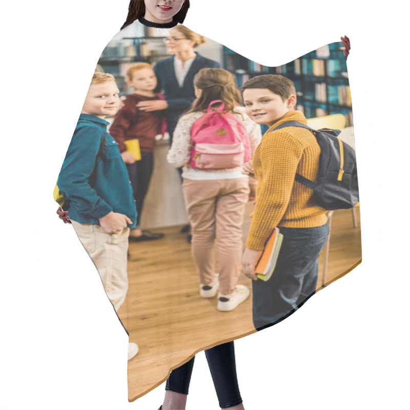 Personality  Boys With Books And Backpacks Looking At Camera In Library  Hair Cutting Cape