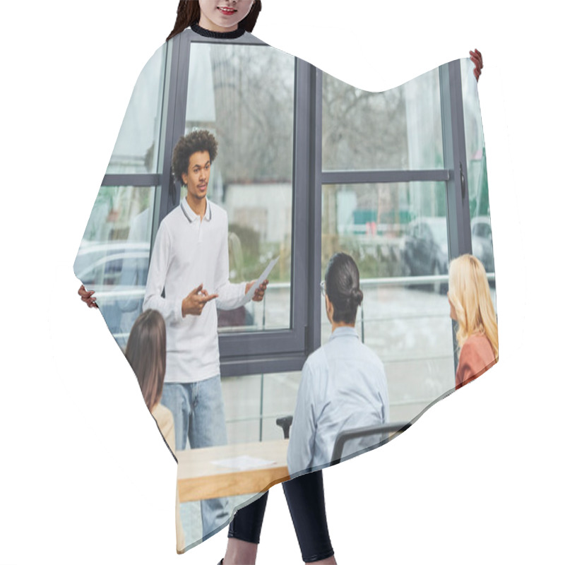 Personality  A Man Presenting To A Group Of People In An Office Setting. Hair Cutting Cape