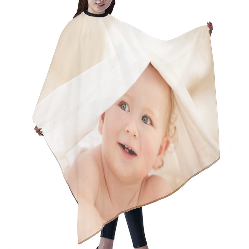 Personality  Smile, Face And Happy Baby On A Bed With Blanket For Playing, Games Or Fun In A Nursery Room. Learning, Child Development And Curious Little Boy Kid In A Bedroom With Sheet Cover While Lying In House. Hair Cutting Cape