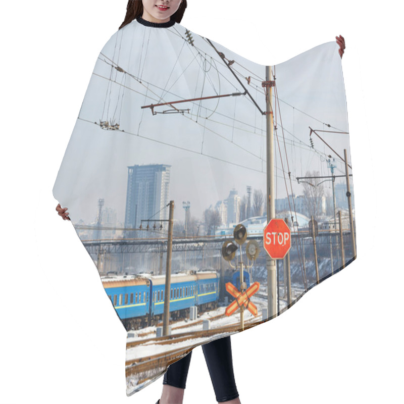 Personality  A Red Stop Sign At A Railroad Crossing Against The Backdrop Of Railroad Tracks, Blue Train Carriages And Cityscape At The Entrance To A Winter City. Hair Cutting Cape