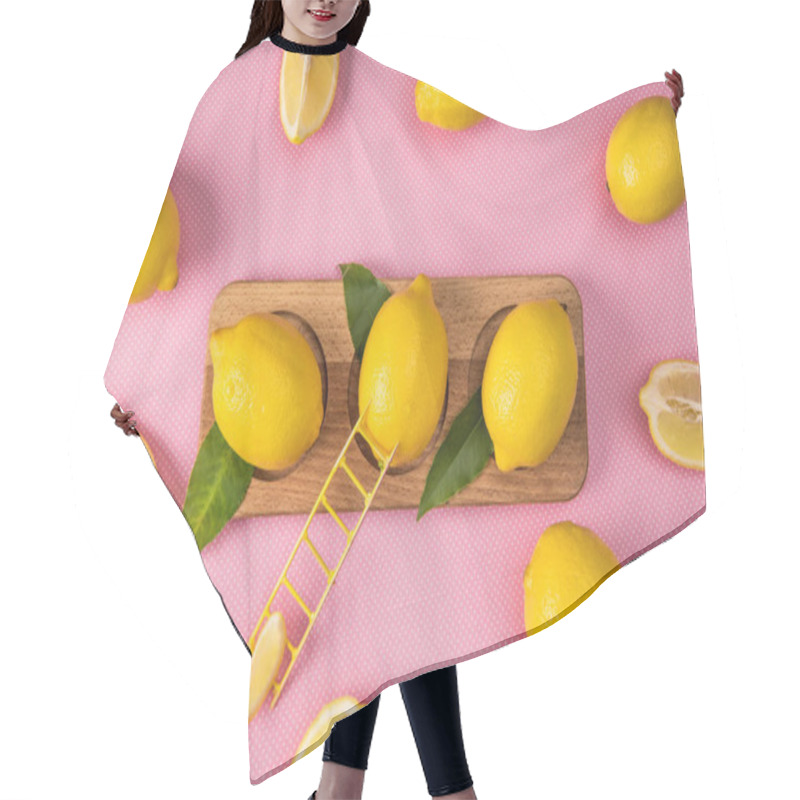 Personality  Top View Of Fresh Yellow Lemons On Wooden Board With Little Ladder On Pink Background  Hair Cutting Cape