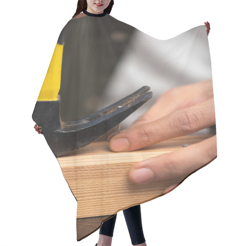 Personality  Cropped View Of Man Picking Up Nail With Manner Near Wooden Board  Hair Cutting Cape