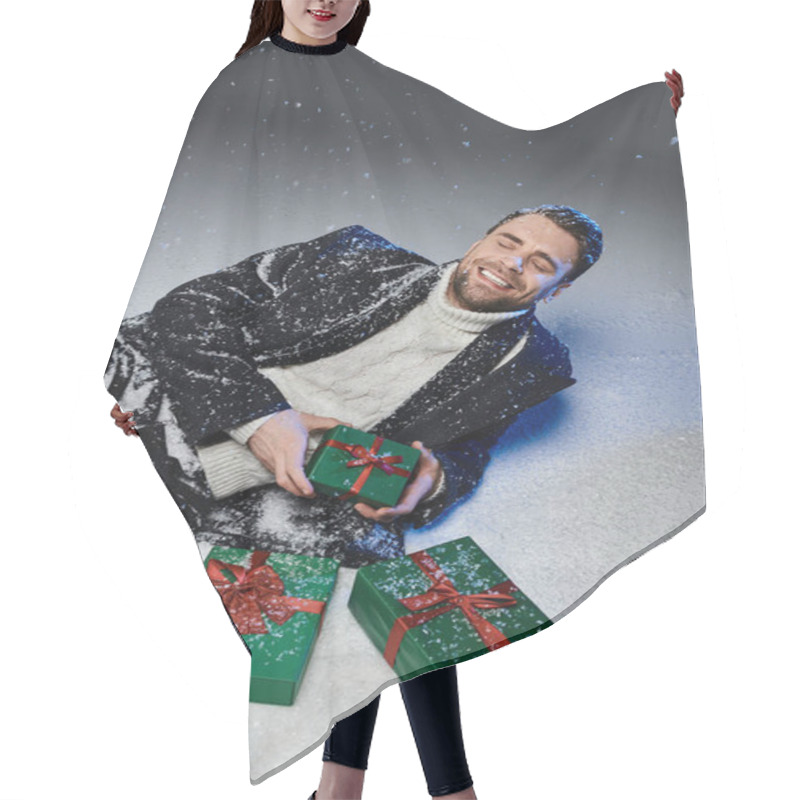 Personality  A Handsome Young Man Smiles While Surrounded By Festive Gift Boxes In The Snow. Hair Cutting Cape