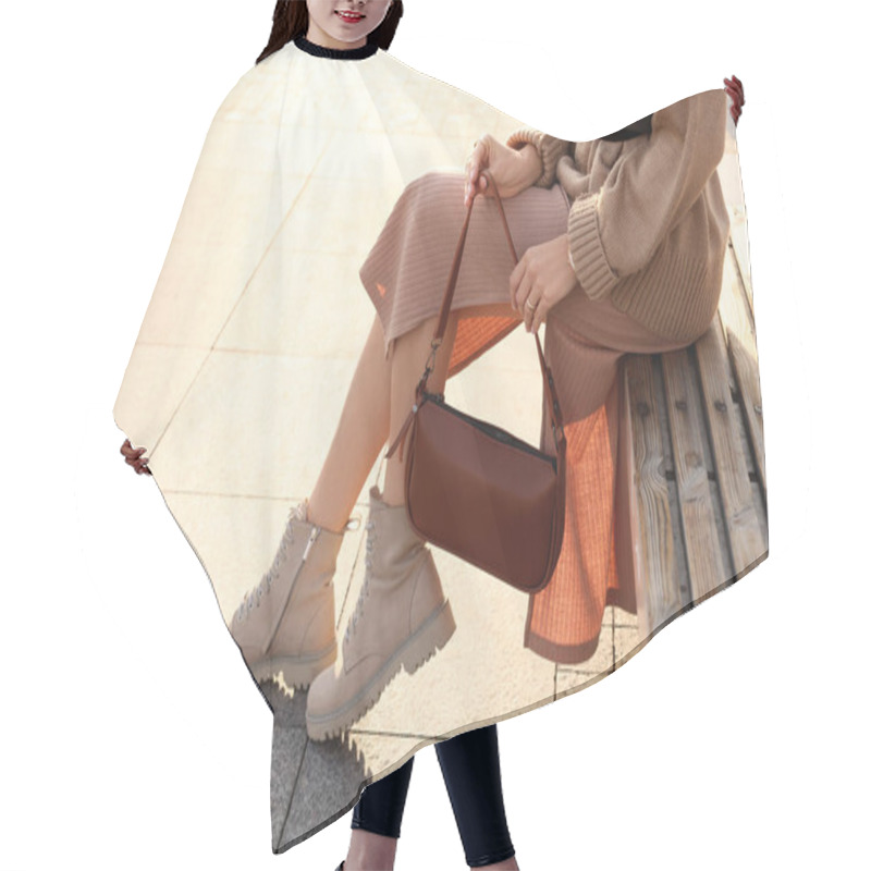 Personality  Fashionable Woman With Stylish Bag On Bench Outdoors, Closeup Hair Cutting Cape