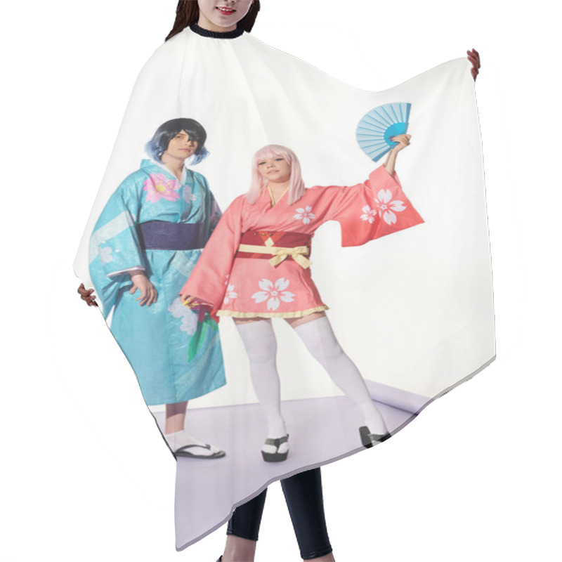 Personality  Anime Style Woman Posing With Hand Fan Near Man In Kimono And Wig On Purple Carpet In White Studio Hair Cutting Cape