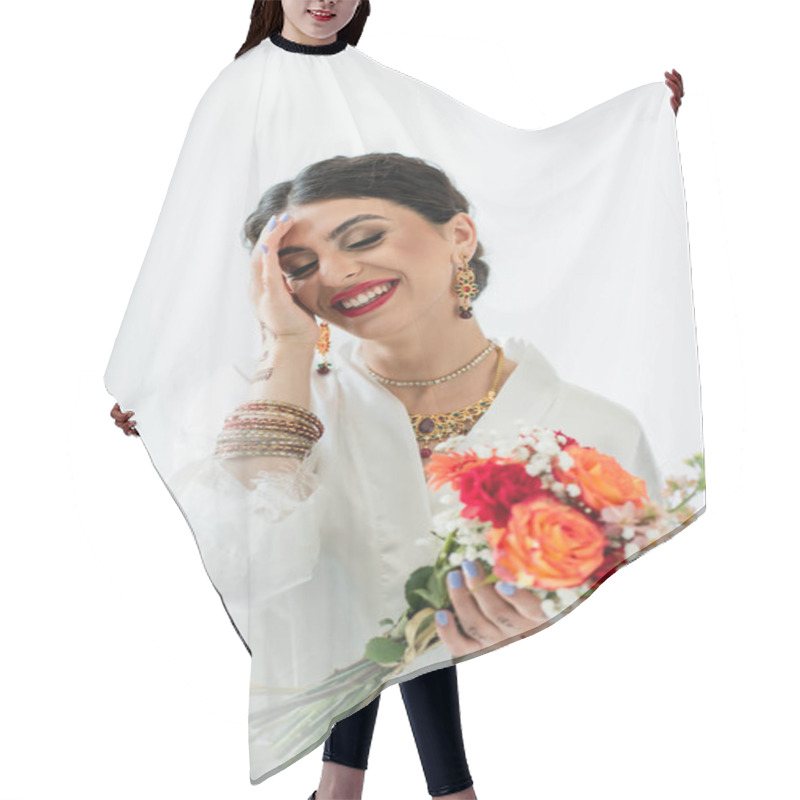 Personality  Cheerful Indian Bride With Mehndi Holding Bouquet Of Flowers On White Hair Cutting Cape