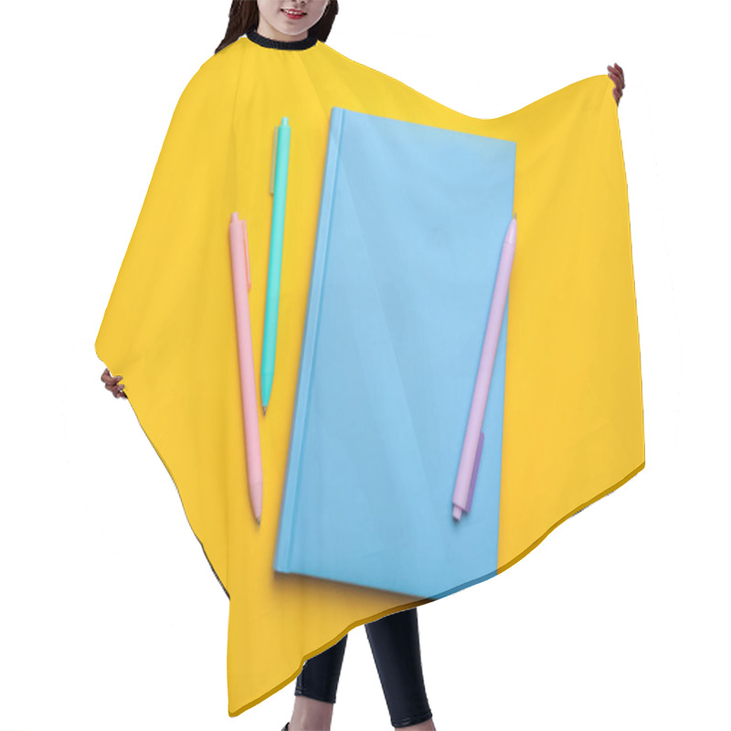 Personality  Light Blue Notebook And Pens On Yellow Background, Flat Lay Hair Cutting Cape