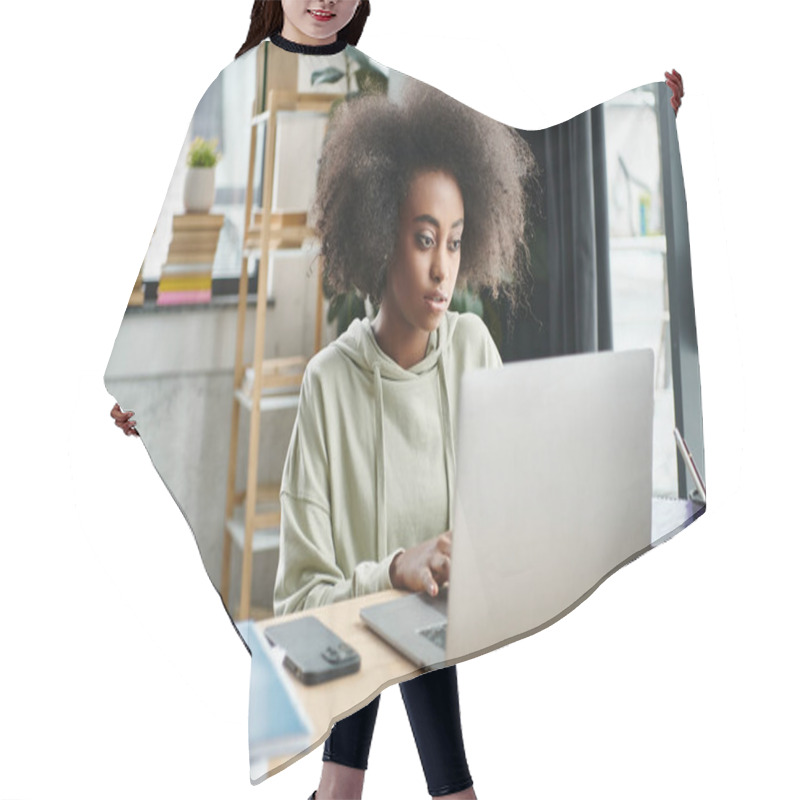 Personality  A Multicultural Woman Engrossed In Work, Seated In Front Of Her Laptop Computer In A Modern Coworking Space. Hair Cutting Cape