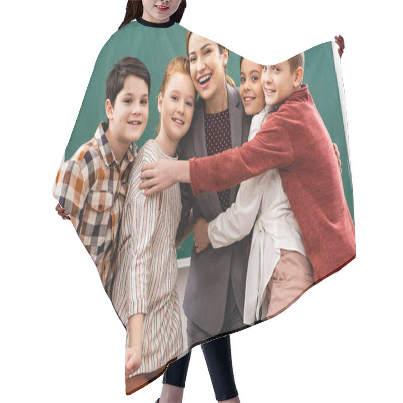 Personality  Happy Pupils Embracing Teacher In Front Of Blackboard In Classroom Hair Cutting Cape