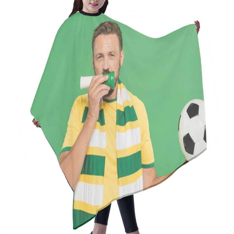 Personality  Bearded Sports Fan Holding Football And Blowing Horn While Cheering Isolated On Green  Hair Cutting Cape