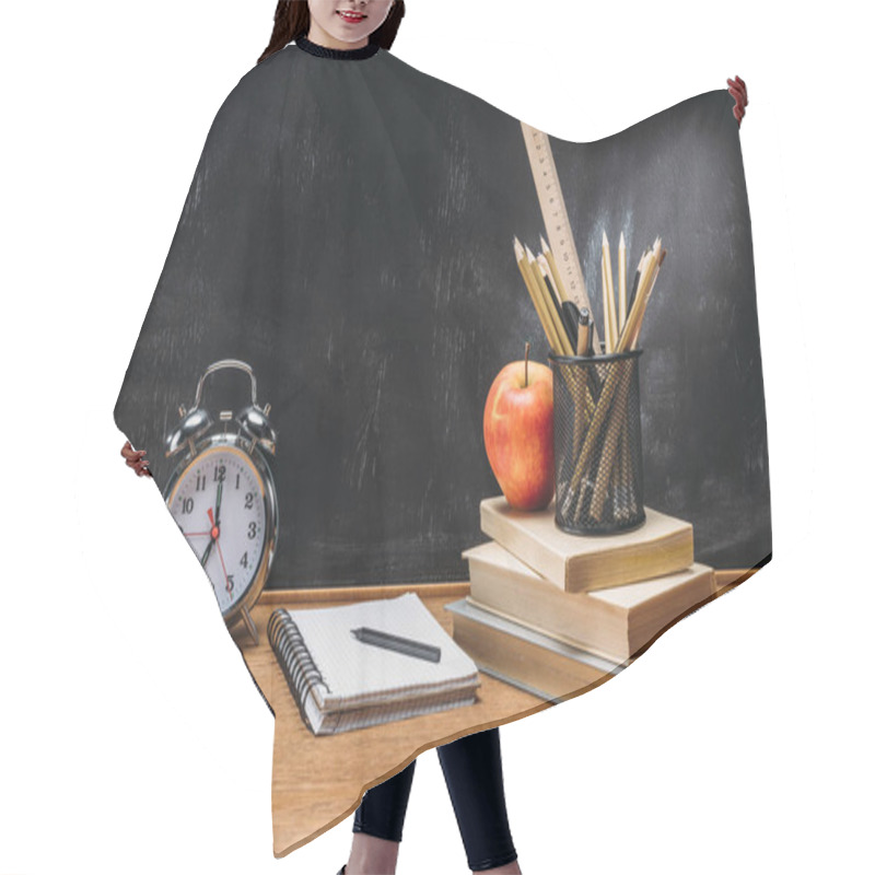 Personality  Close Up View Of Fresh Apple, Clock, Notebook, Pencils And Books On Wooden Tabletop With Empty Blackboard Behind Hair Cutting Cape