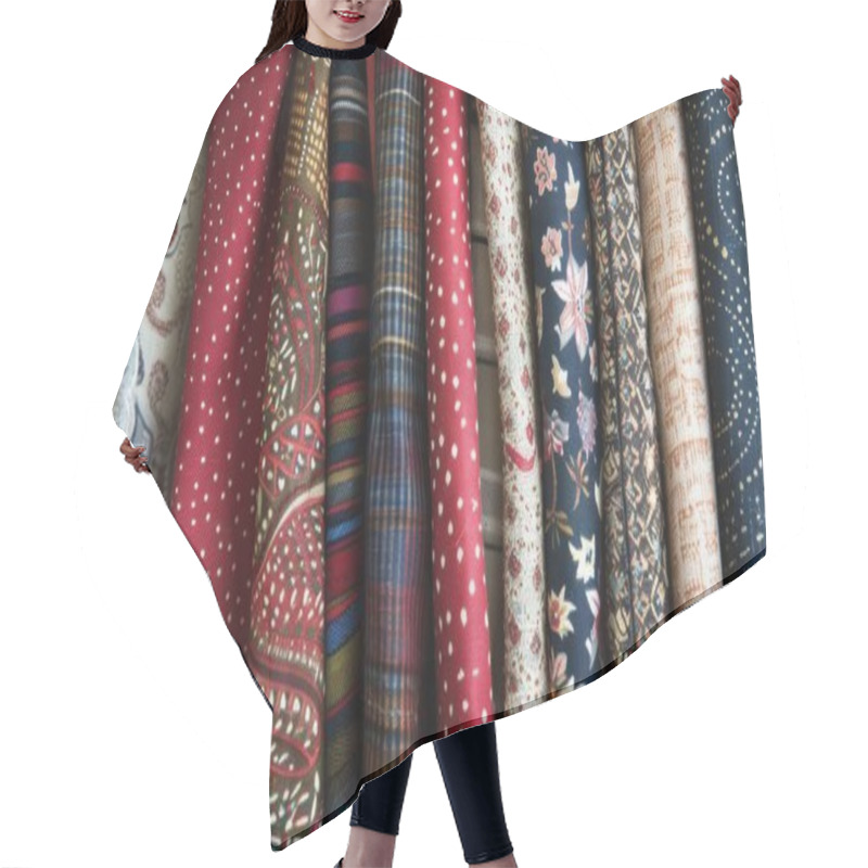 Personality  A Vibrant Collection Of Patterned Fabrics Hanging In A Row, Showcasing Rich Colors And Intricate Designs. Hair Cutting Cape