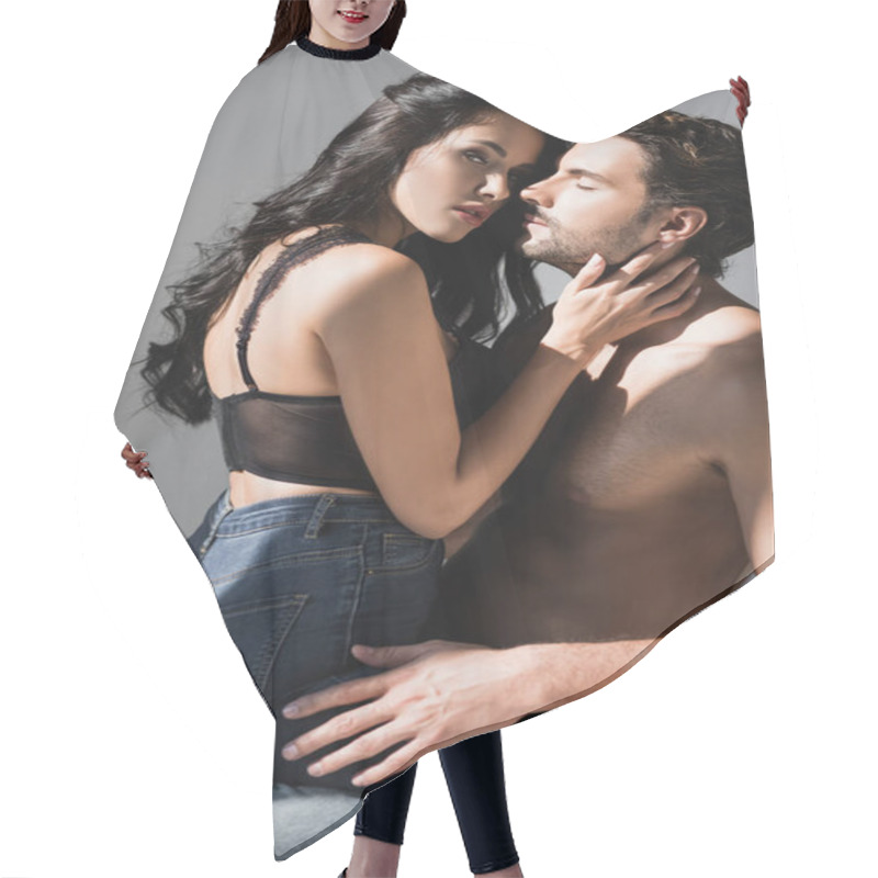 Personality  Seductive Woman In Bra And Jeans Touching Shirtless Man On Chair Isolated On Grey  Hair Cutting Cape