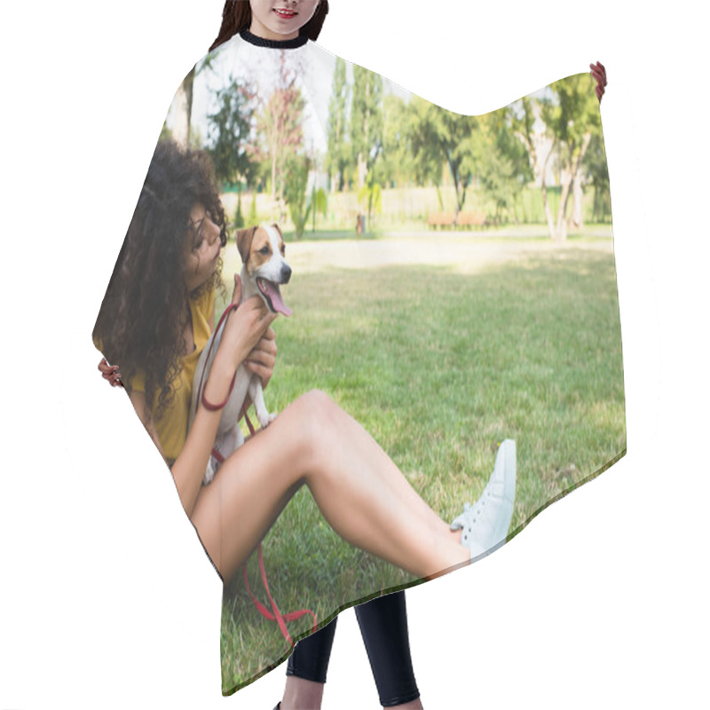 Personality  Side View Of Young Woman Sitting On Grass And Holding Jack Russell Terrier Dog  Hair Cutting Cape