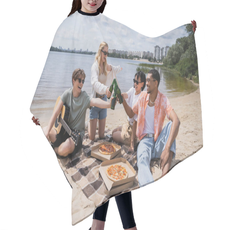 Personality  Excited Multiethnic Friends In Sunglasses Clinking Beer Bottles During Picnic On Beach Hair Cutting Cape