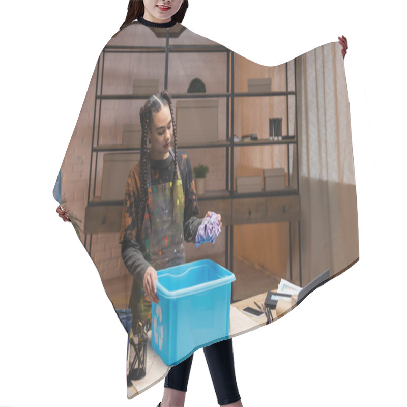 Personality  African American Craftswoman Holding Cloth Near Box With Recycle Sign And Devices In Workshop  Hair Cutting Cape