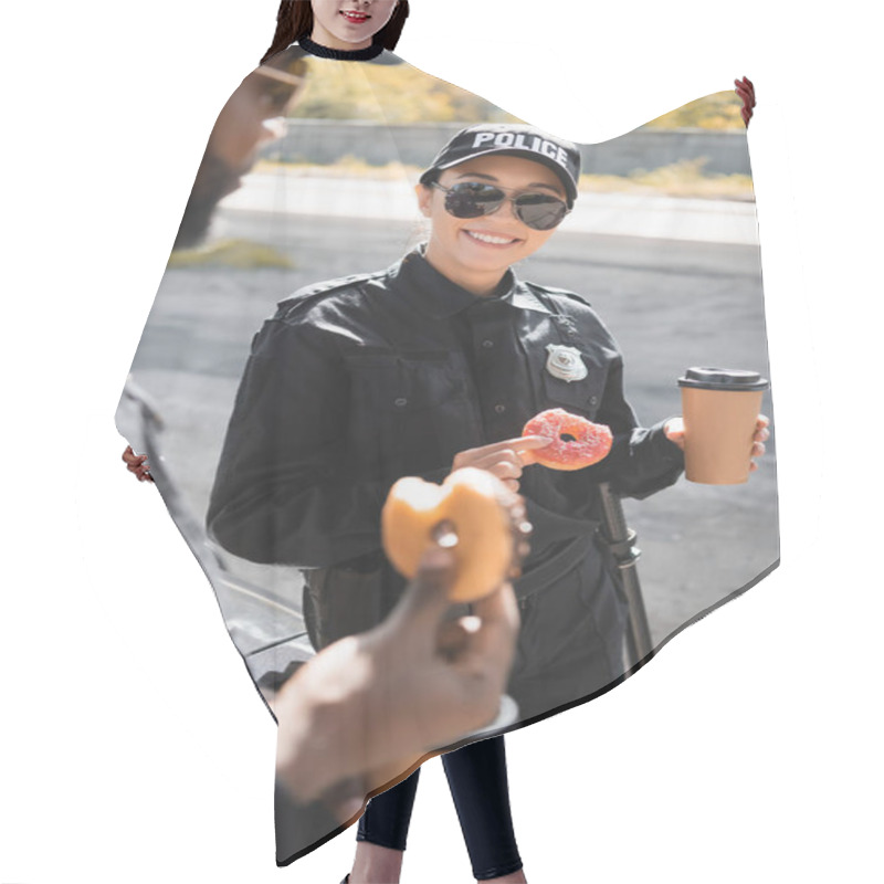 Personality  Happy Policewoman With Doughnut And Paper Cup Standing Near African American Colleague On Blurred Foreground Outdoors Hair Cutting Cape