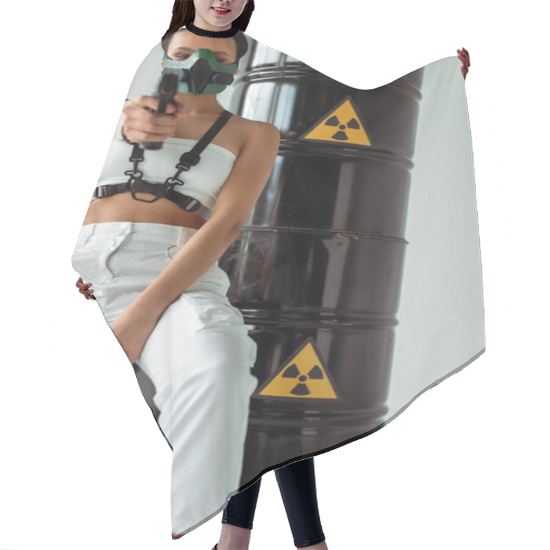 Personality  Selective Focus Of Futuristic African American Woman In Safety Mask Aiming Gun Near Radioactive Waste Barrels On White Background Hair Cutting Cape