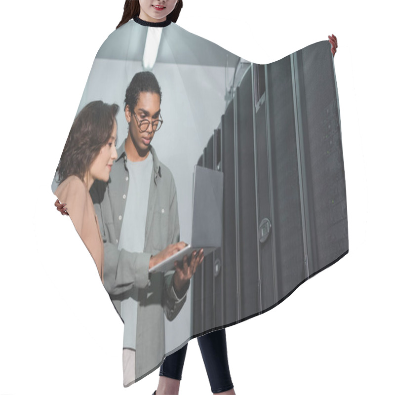 Personality  African American Programmer Showing Laptop To Colleague While Working In Data Center Hair Cutting Cape