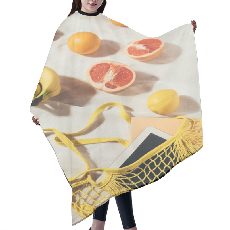 Personality  Digital Tablet In Yellow String Bag And Fresh Ripe Tropical Fruits   Hair Cutting Cape