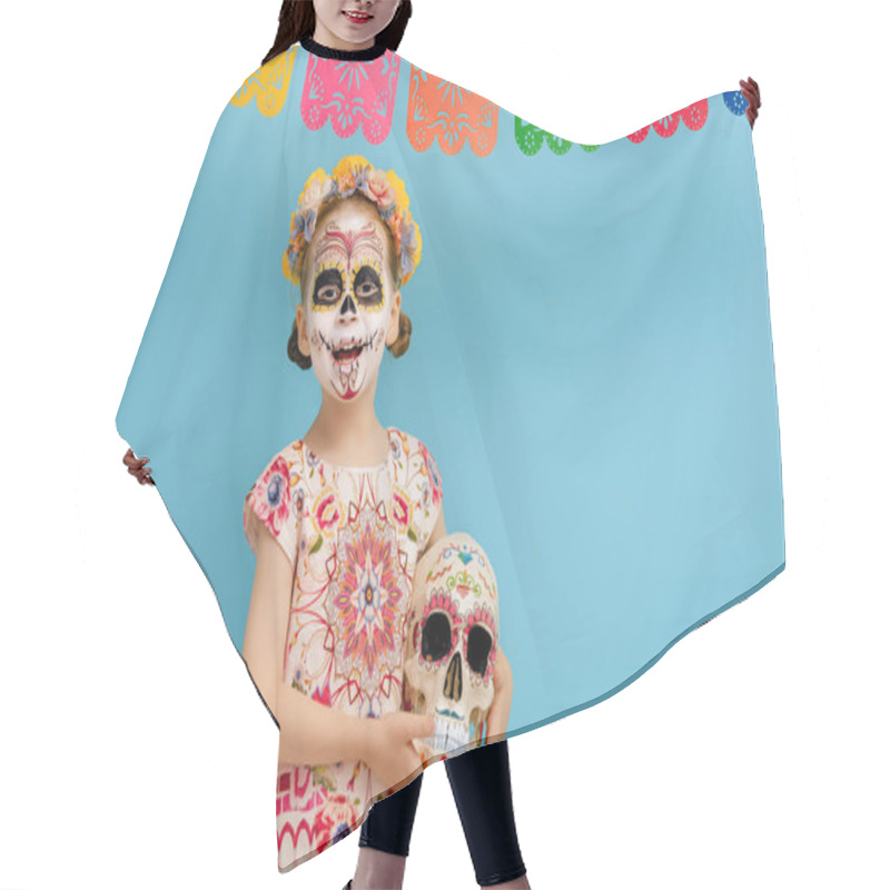 Personality  Adorable Zombie In Flower Wreath Posing On Blue Background. Happy Child With Halloween Creative Makeup. Girl Celebrating For Mexican Day Of The Dead. Hair Cutting Cape