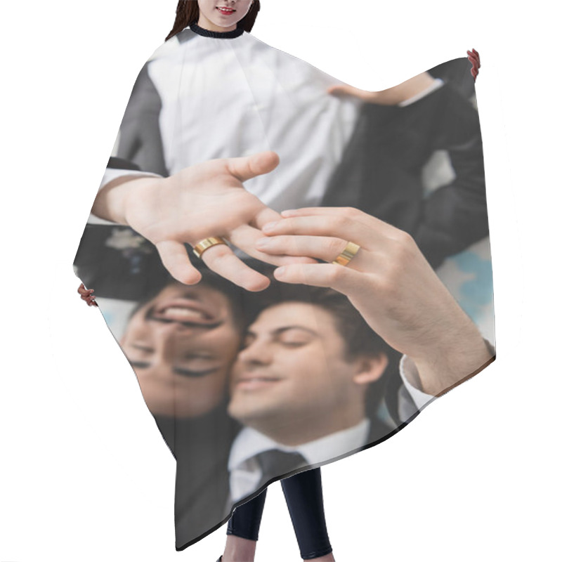 Personality  Top View Of Blurred Same Sex Grooms In Suits Touching Fingers Of Each Other In Wedding Rings While Lying On Festive Confetti On Grey Background  Hair Cutting Cape