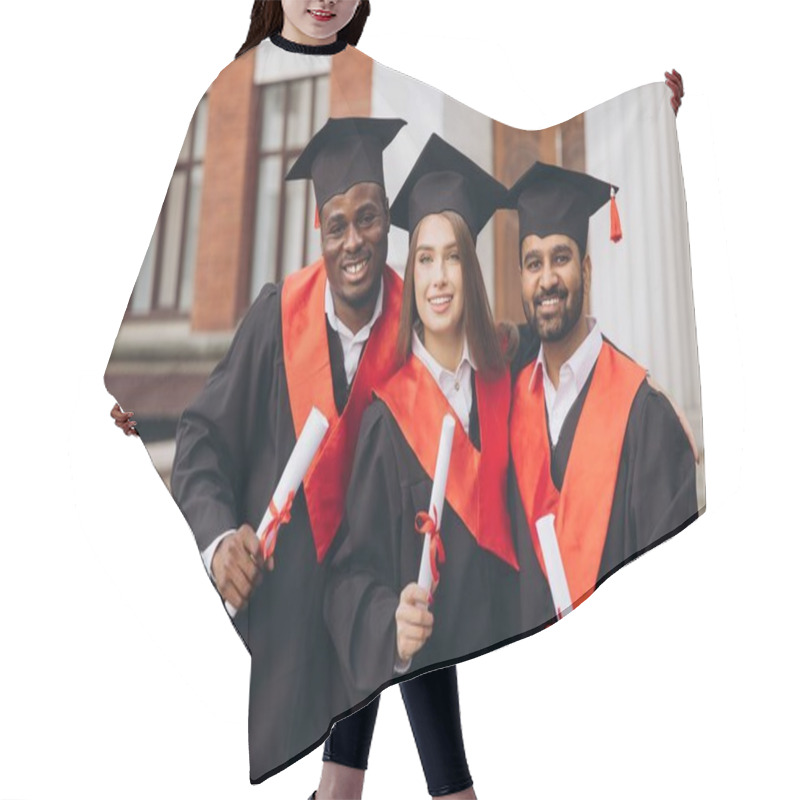 Personality  Three Joyful Graduates Wearing Caps And Gowns Proudly Display Their Diplomas. They Stand Together On A University Campus, Representing Success And Achievement. Hair Cutting Cape