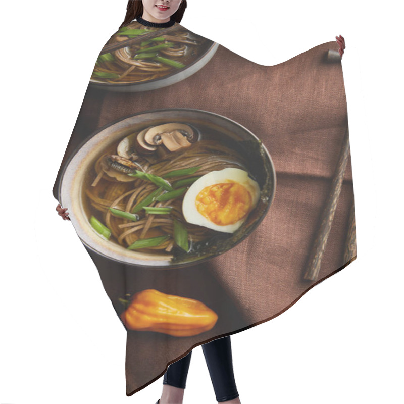 Personality  Top View Of Traditional Spicy Ramen In Bowls With Chopsticks And Vegetables On Brown Napkin On Stone Surface Hair Cutting Cape