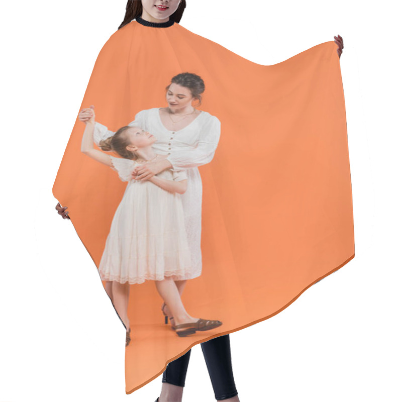 Personality  Summer Trends, Mother Holding Hands With Preteen Daughter And Standing Together On Orange Background, White Sun Dresses, Togetherness, Fashion And Style Concept, Bonding And Love  Hair Cutting Cape