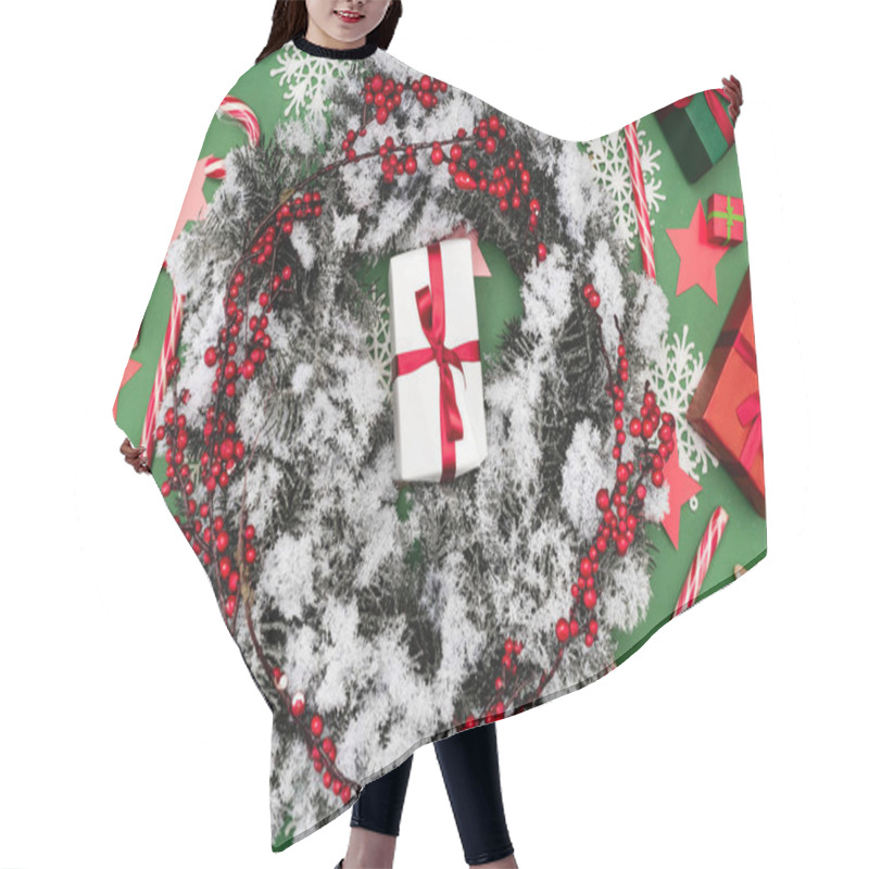 Personality  Top View Of Juniper Wreath, Covered With Snow, Near Gift Boxes And Candy Canes On Green Hair Cutting Cape