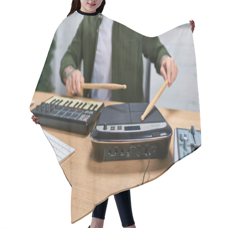 Personality  A Handsome Asian Man Plays A Drum Pad In A Studio Setting. Hair Cutting Cape