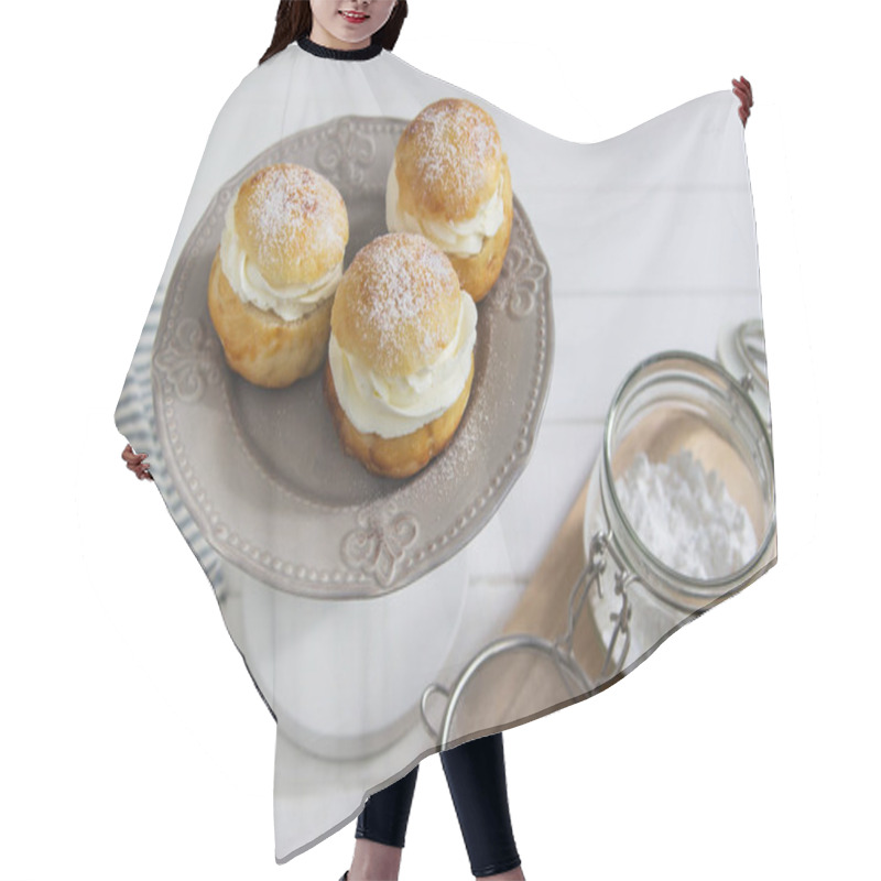 Personality  Fastelavn buns sweet powder traditional nordic food. hair cutting cape