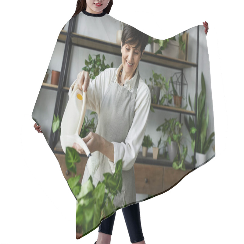 Personality  A Woman Joyfully Waters Her Thriving Plants In Her Cozy Studio. Hair Cutting Cape