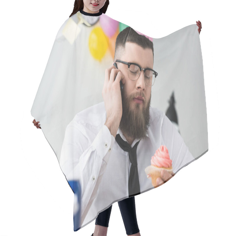 Personality  Portrait Of Businessman In Party Cone With Birthday Cupcake In Hand Talking On Smartphone Hair Cutting Cape