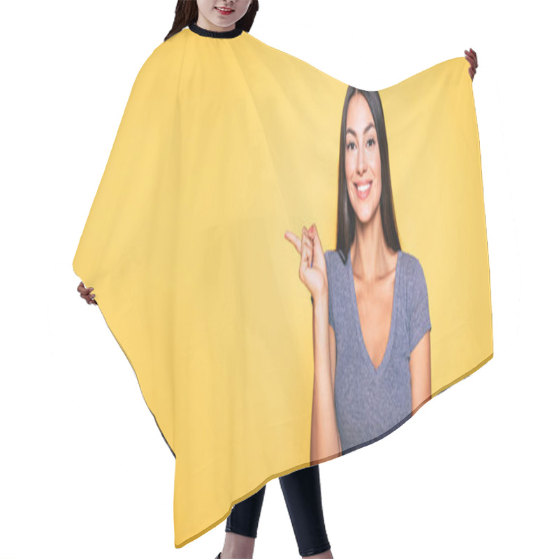 Personality  Portrait Of Smiling Brunette Gesturing With Finger On Yellow Background Hair Cutting Cape