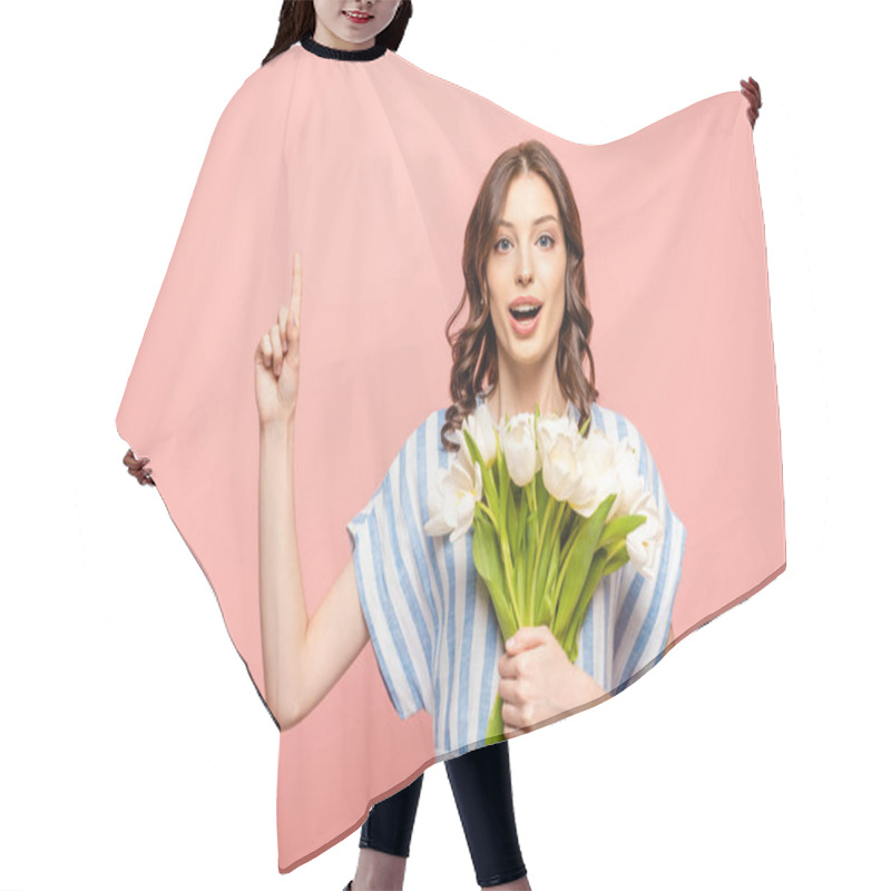 Personality  Surprised Girl Showing Idea Gesture While Holding Bouquet Of White Tulips And Looking At Camera Isolated On Pink Hair Cutting Cape