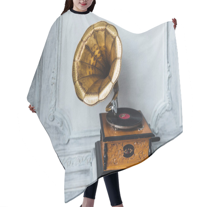 Personality  Old Gramophone With Horn Speaker Stands Against Anicent Background, Produces Songs Recorded On Plate. Music And Nostalgia Concept. Gramophone With Phonograph Record Hair Cutting Cape