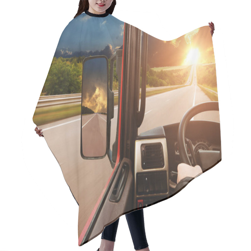 Personality  Truck Dashboard With Drivers Hand On The Steering Wheel And Side Rear-view Mirror On The Countryside Road Against Night Sky With Sunset Hair Cutting Cape