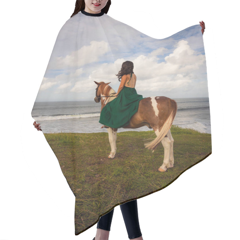 Personality  Woman Riding Horse Near The Ocean. Outdoor Activities. Asia Woman Wearing Long Green Dress. Traveling Concept. Cloudy Sky. View From Back. Vertical Layout. Copy Space. Bali, Indonesia Hair Cutting Cape