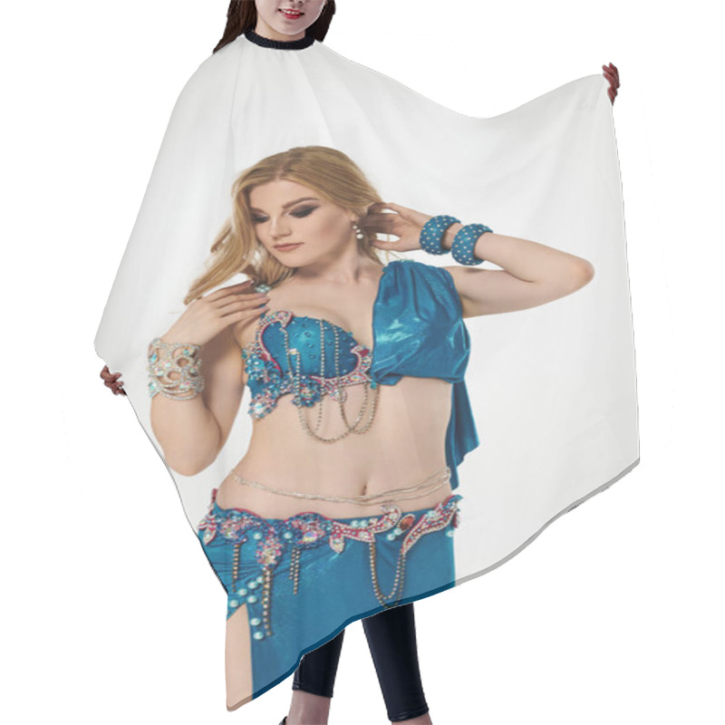 Personality  Graceful Woman In Vibrant Blue Belly Dance Attire. Hair Cutting Cape