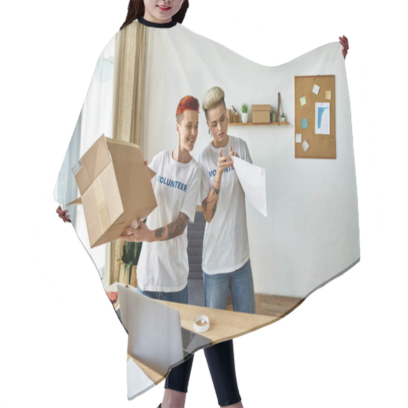 Personality  A Young Lesbian Couple In Volunteer T-shirts Holding A Donation Box, Working Together In Charity. Hair Cutting Cape