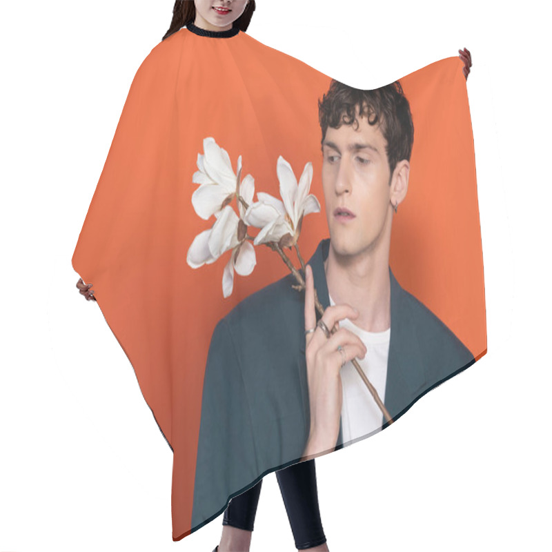 Personality  Stylish Brunette Man Looking At Magnolia Flowers On Orange Background Hair Cutting Cape