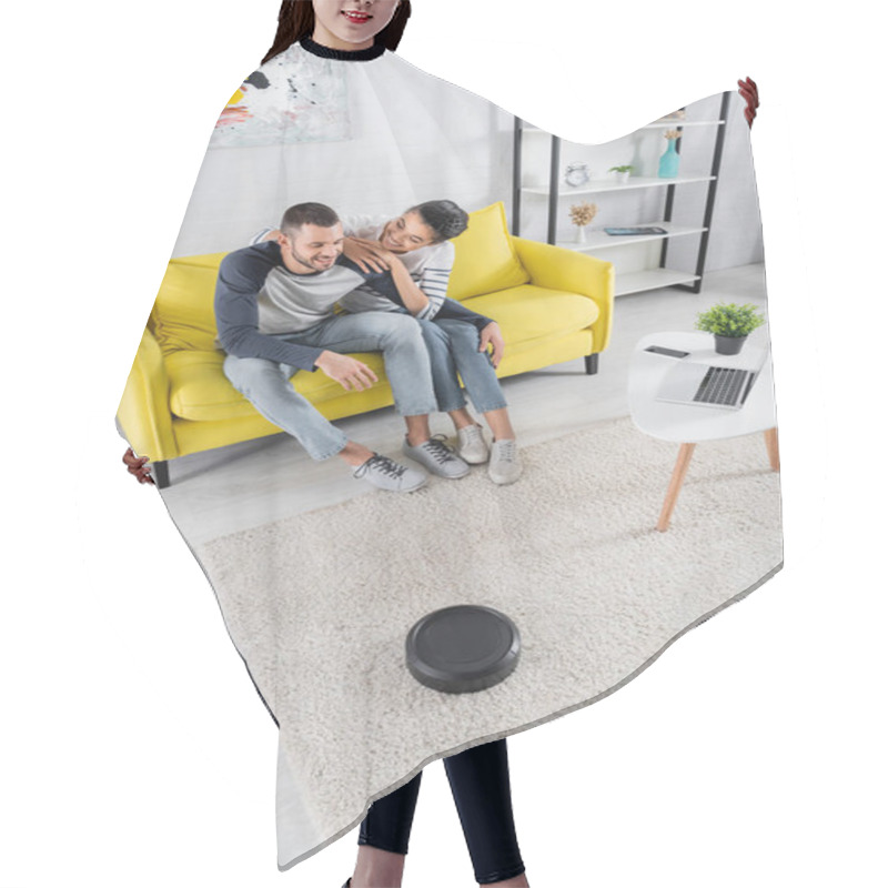 Personality  Smiling African American Woman Embracing Boyfriend Near Robotic Vacuum Cleaner And Devices  Hair Cutting Cape