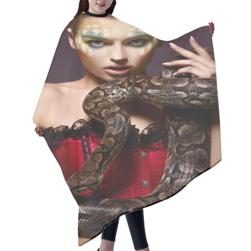 Personality  Serpent. Fantasy. Fancy Woman Holding Tamed Snake In Hands Hair Cutting Cape