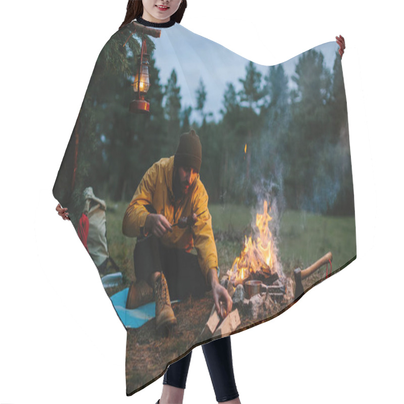 Personality  A Lonely Wanderer Is Having Dinner In The Mountains By A Campfire. Hair Cutting Cape