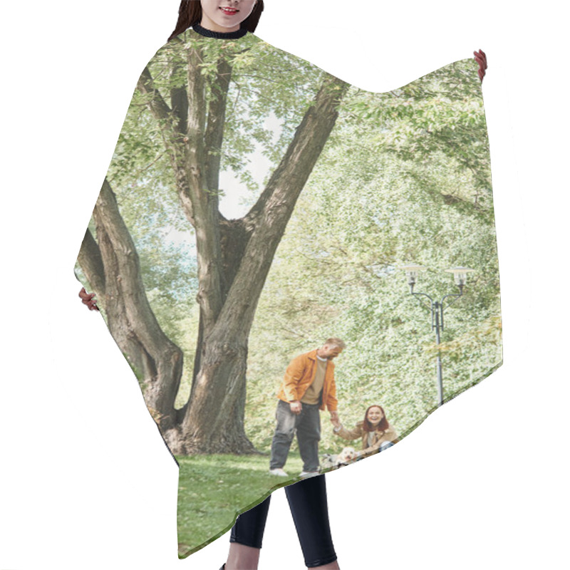 Personality  A Couple Walks Their Dog In A Serene Park Setting. Hair Cutting Cape