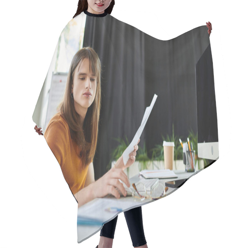 Personality  This Individual Is Thoughtfully Examining Printed Documents While Seated At A Desk. Hair Cutting Cape