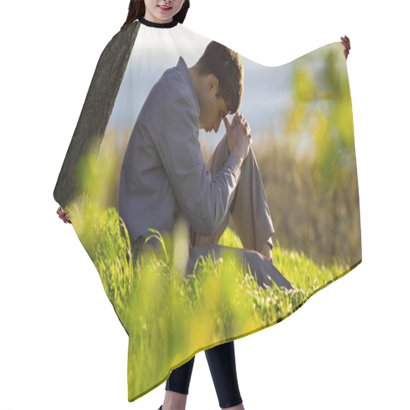 Personality  Young Man Praying To God In The Nature Bowing His Head To His Knees, Concept Religion Hair Cutting Cape