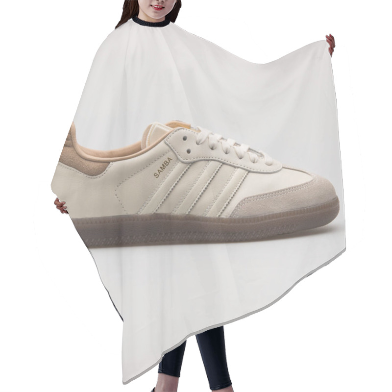 Personality  VIENNA, AUSTRIA - AUGUST 24, 2017: Adidas Samba Off White And Khaki Sneaker On White Background. Hair Cutting Cape