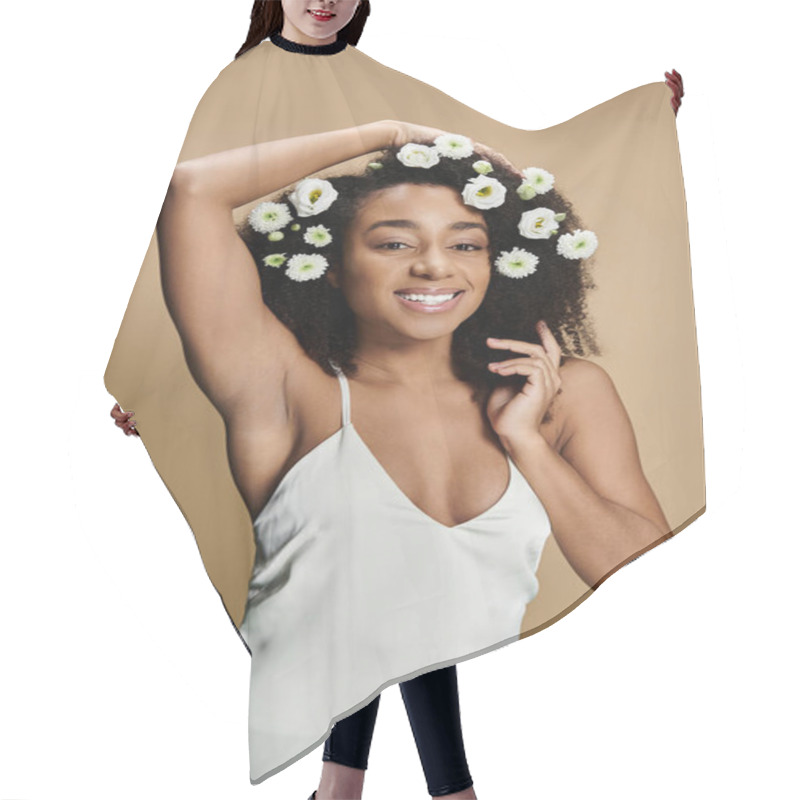 Personality  A Beautiful African American Woman With Natural Makeup And White Flowers In Her Hair, Smiling Against A Beige Background. Hair Cutting Cape